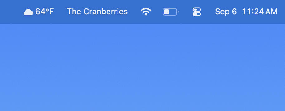 macOS menu bar showing the artist name The Cranberries sitting next to the clock